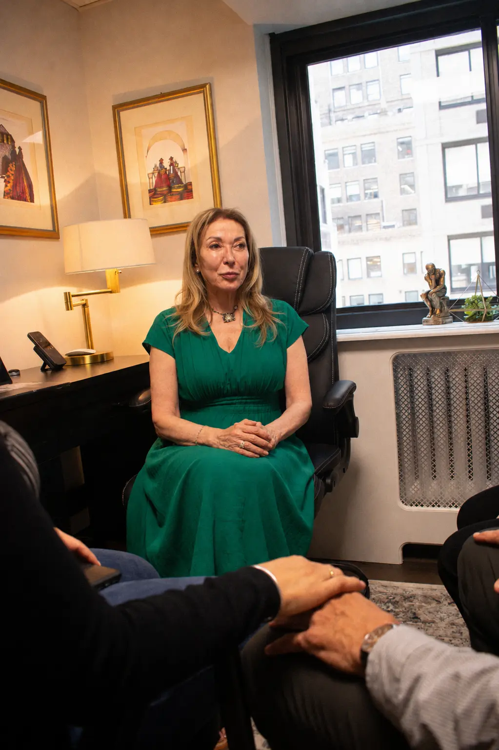 Iris Yankelevich speaking with clients during a session in the Manhattan office