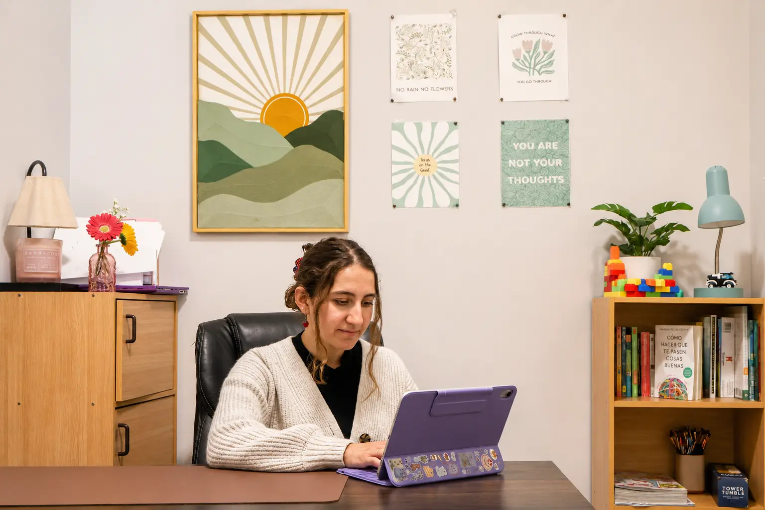Therapist working at her desk in a child-friendly therapy room
